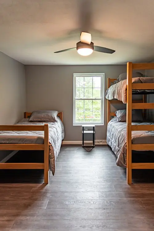 Inside image of a room with three beds