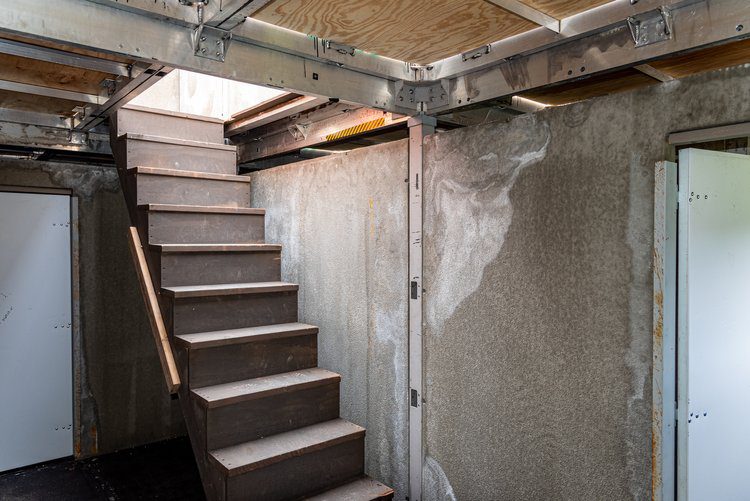Stairs going upward from inside a house