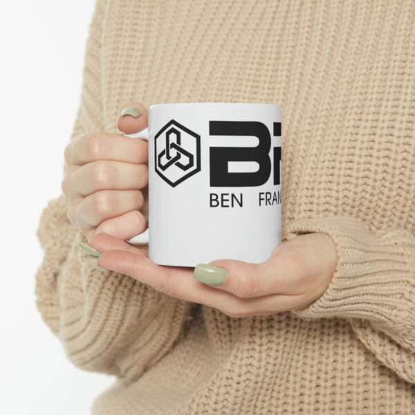 A woman holding up a BFR Logo - Ceramic Mug 11oz that says "Ben for life".