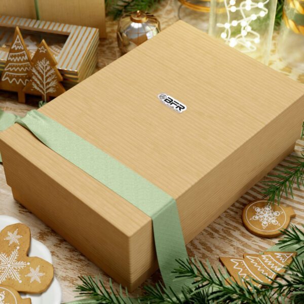 A festive Christmas gift box adorned with delicious gingerbread cookies and embellished with the BFR Logo - Vinyl Die-Cut Stickers, placed enticingly on a table.