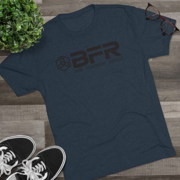 The BFR - Logo - Unisex Tri-Blend Crew Tee on a navy t - shirt with a pair of sneakers and a pair of shoes.