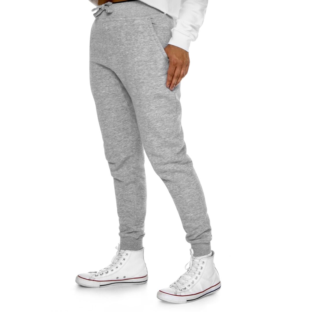 A woman sporting BFR Logo - Women's Premium Fleece Joggers and white sneakers.