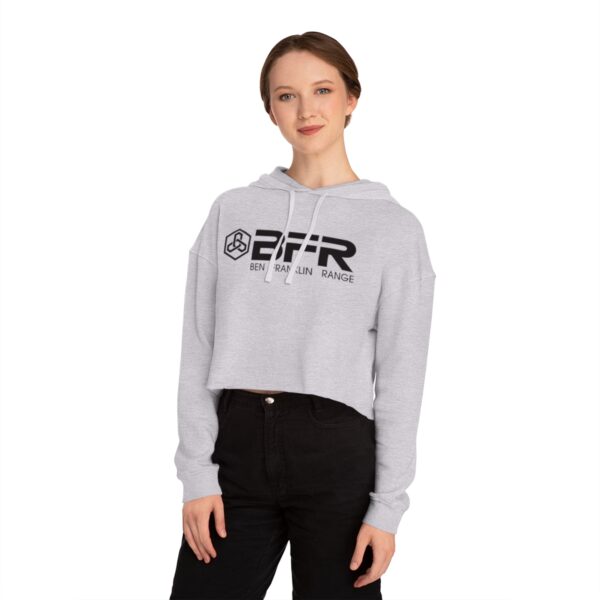 A woman wearing the BFR Logo - Women’s Cropped Hooded Sweatshirt on a grey cropped hoodie.