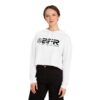 A woman wearing a white crop hoodie with the BFR Logo - Women’s Cropped Hooded Sweatshirt on it.