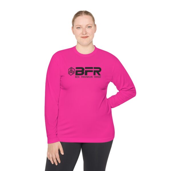 A woman wearing a pink long-sleeve BFR Logo - Unisex Lightweight Long Sleeve Tee with the words bfr on it.