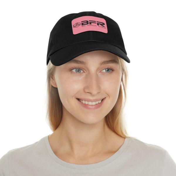A woman wearing a black BFR Logo - Dad Hat with Leather Patch (Rectangle) on it.