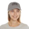 A woman wearing a BFR Logo - Dad Hat with Leather Patch (Rectangle).