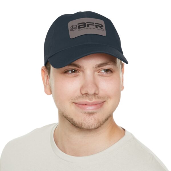 A man wearing a BFR Logo - Dad Hat with Leather Patch (Rectangle) on it.