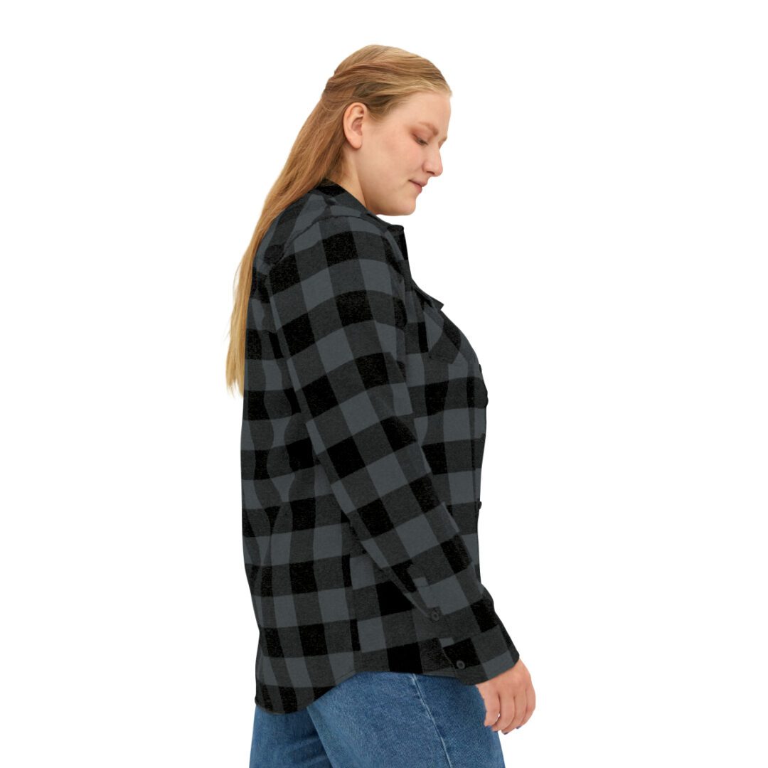 A woman wearing a BFR Logo - Unisex Flannel Shirt. A woman wearing a BFR Logo - Unisex Flannel Shirt.