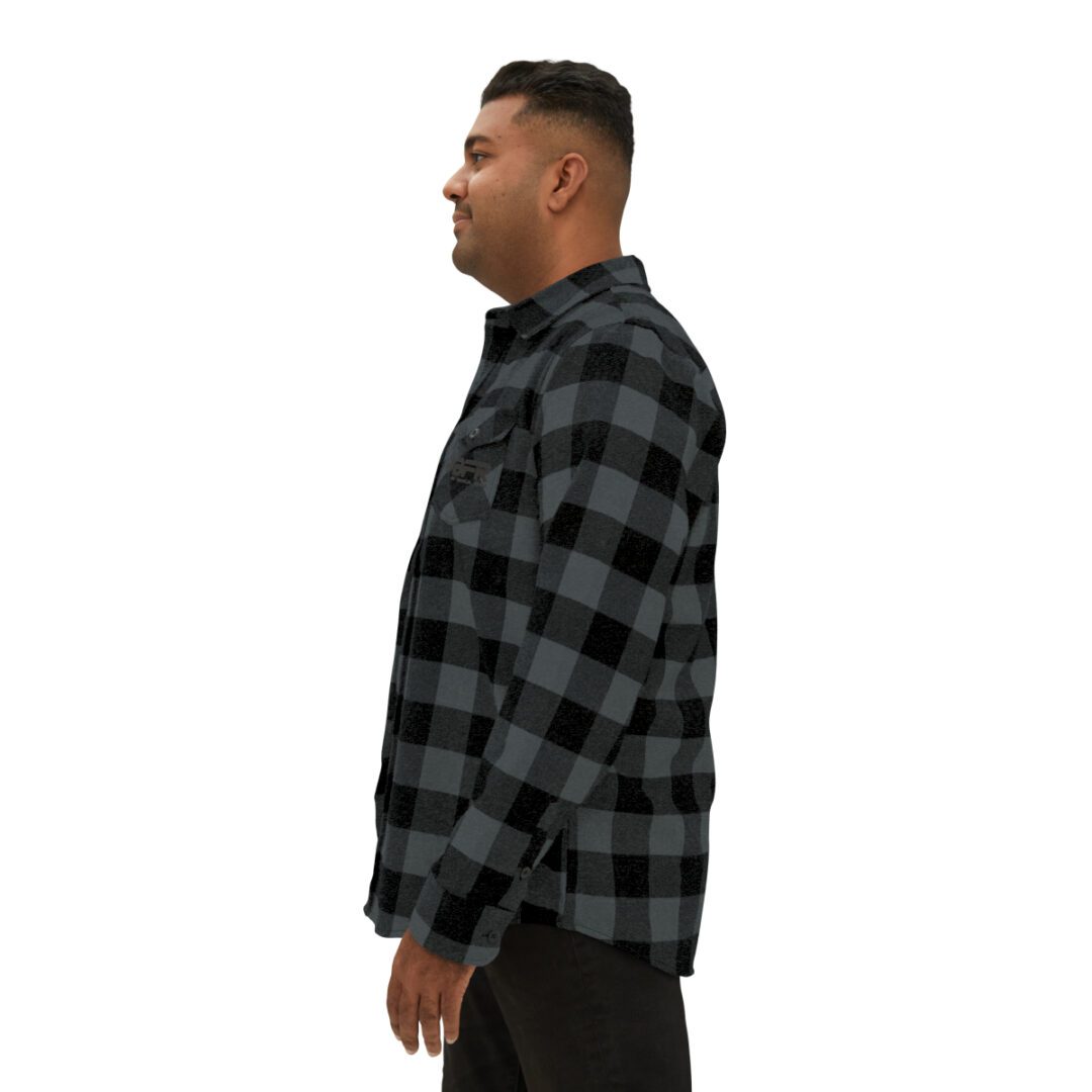 A man wearing a BFR Logo - Unisex Flannel Shirt. A man wearing a BFR Logo - Unisex Flannel Shirt.