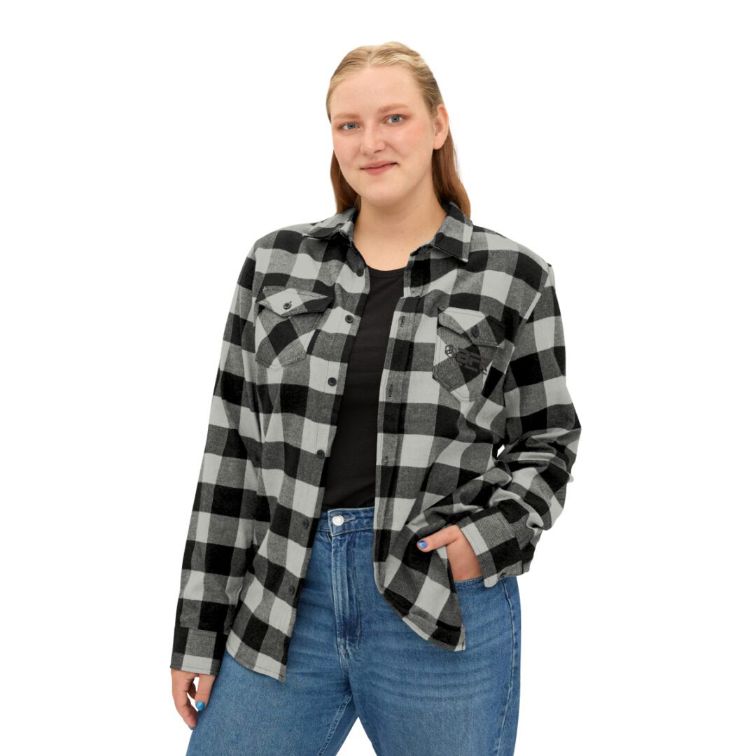 A woman wearing a BFR Logo - Unisex Flannel Shirt. A woman wearing a BFR Logo - Unisex Flannel Shirt.