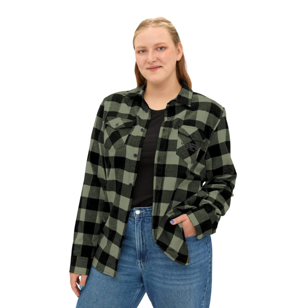 A woman wearing a BFR Logo - Unisex Flannel Shirt. A woman wearing a BFR Logo - Unisex Flannel Shirt.