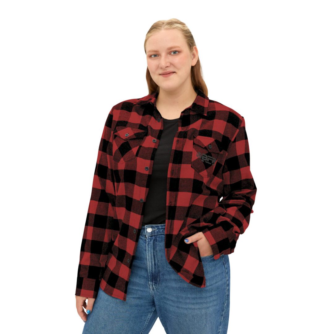 A woman wearing a BFR Logo - Unisex Flannel Shirt. A woman wearing a BFR Logo - Unisex Flannel Shirt.