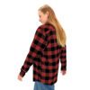 A woman wearing a BFR Logo - Unisex Flannel Shirt in red and black plaid.