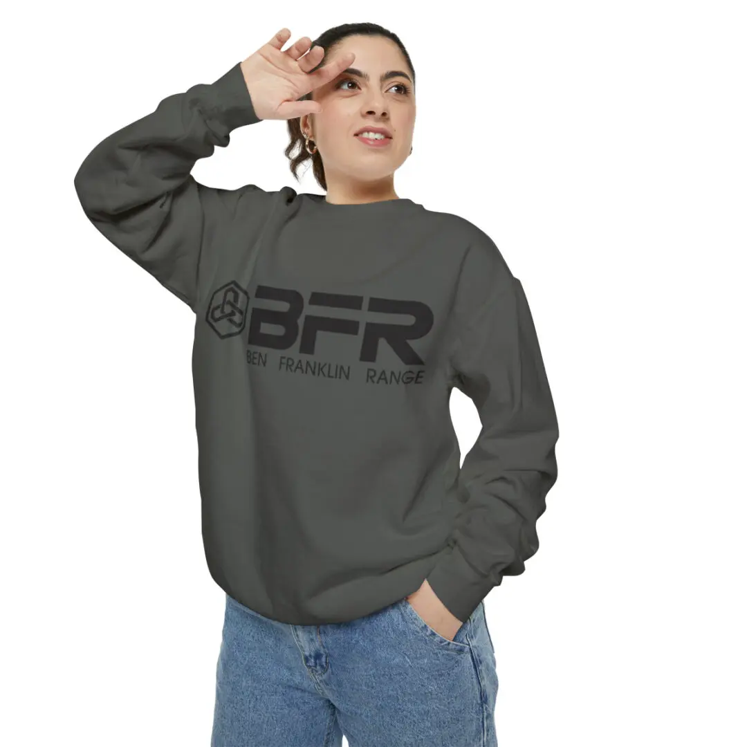 A woman wearing a BFR Logo - Unisex Garment-Dyed Sweatshirt with the word bfr on it.