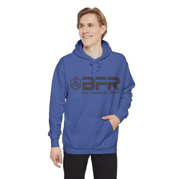 A man wearing a blue BFR Logo - Unisex Garment-Dyed Hoodie with the word afr on it.