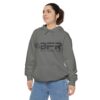 A woman wearing a grey BFR Logo - Unisex Garment-Dyed Hoodie with the word bfr on it.