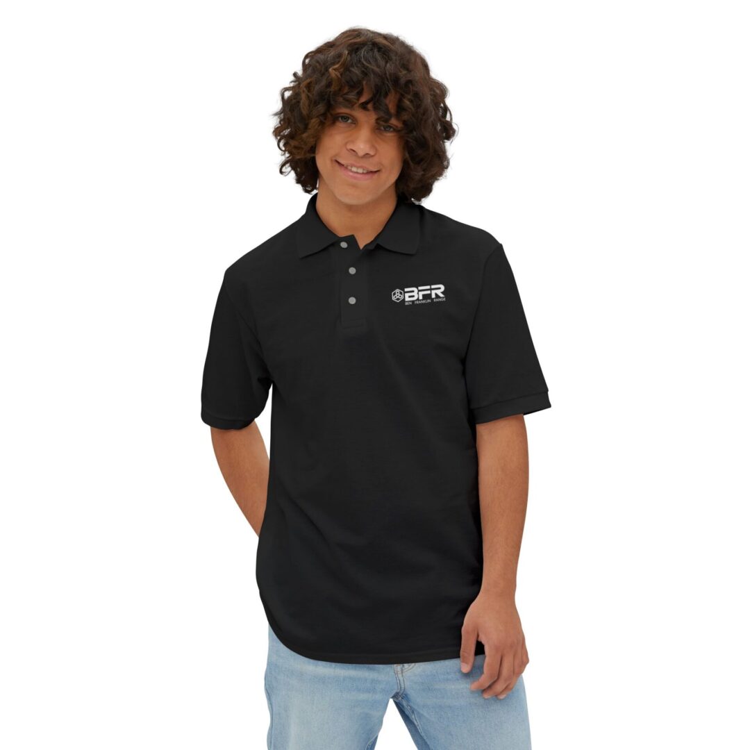 Man wearing black BFR polo shirt smiling.