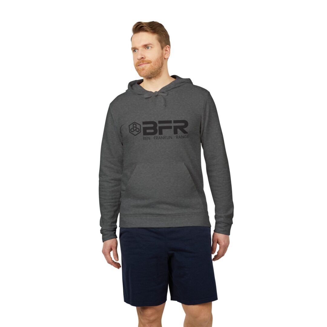 Man in gray hoodie and navy shorts.