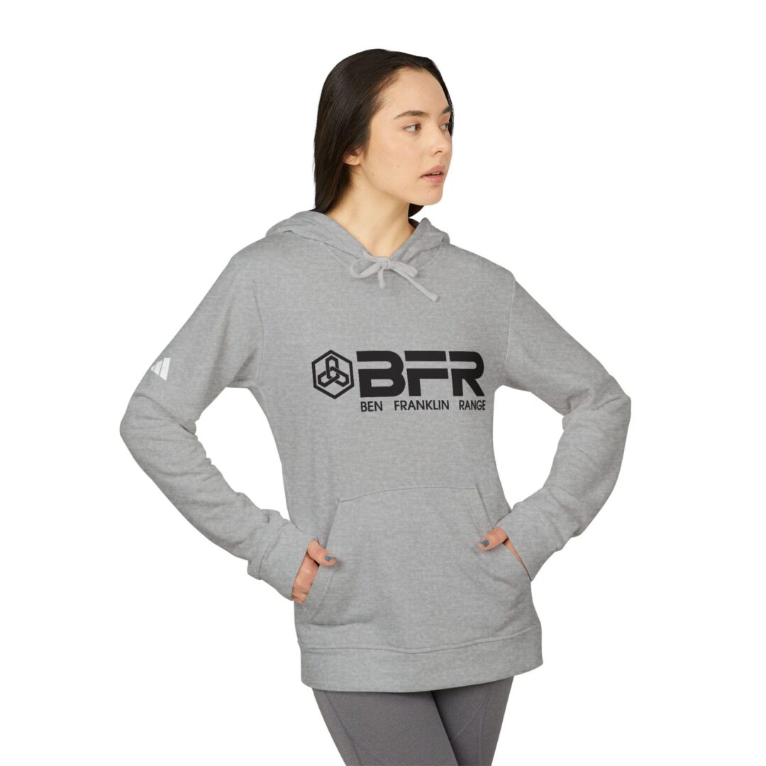 Woman wearing gray BFR hoodie, side view.