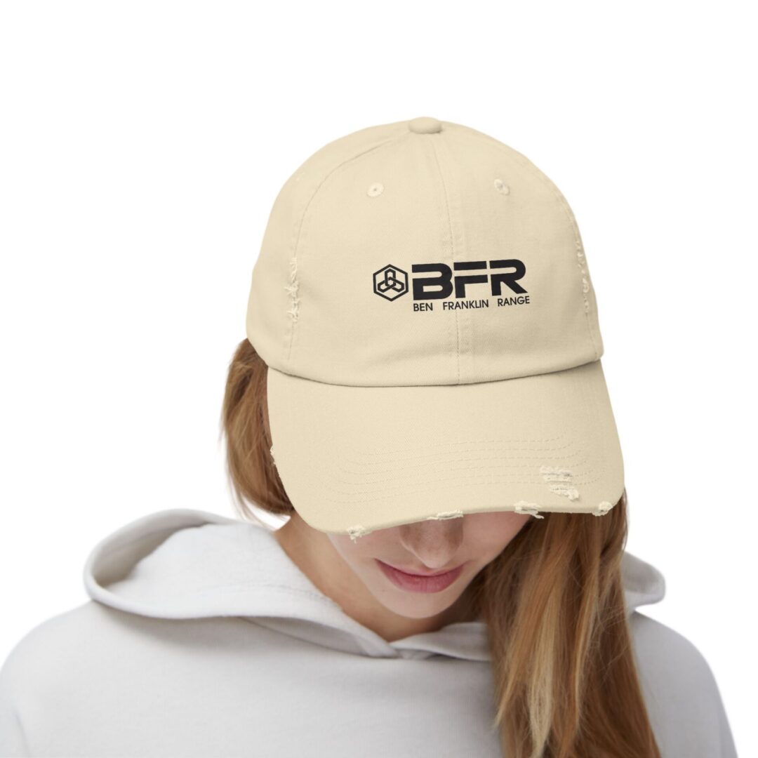 Beige distressed dad hat; Ben Franklin Range logo.