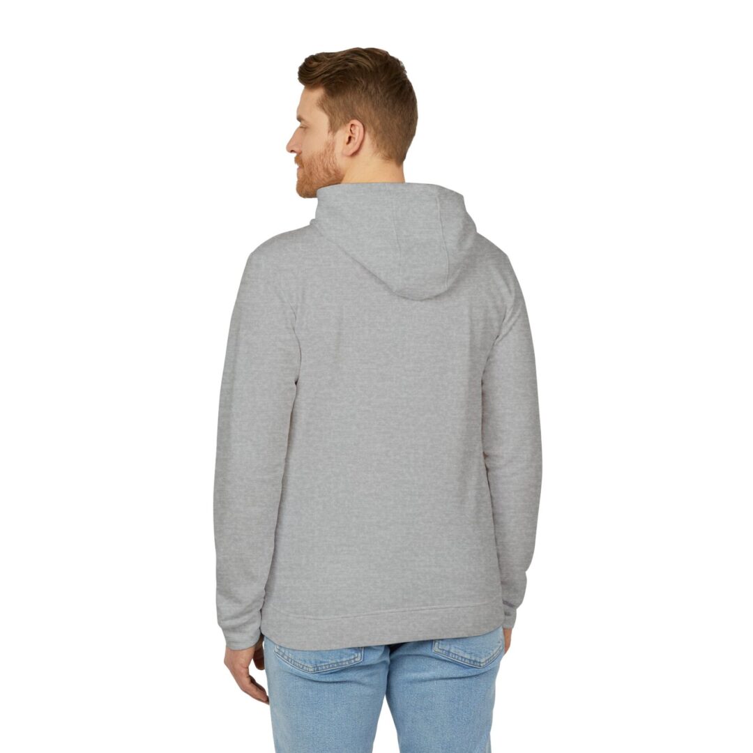 Man wearing gray hoodie, blue jeans, rear view.