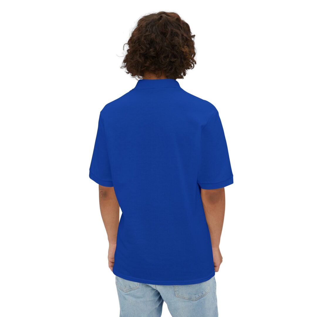 Person in blue shirt, back view.