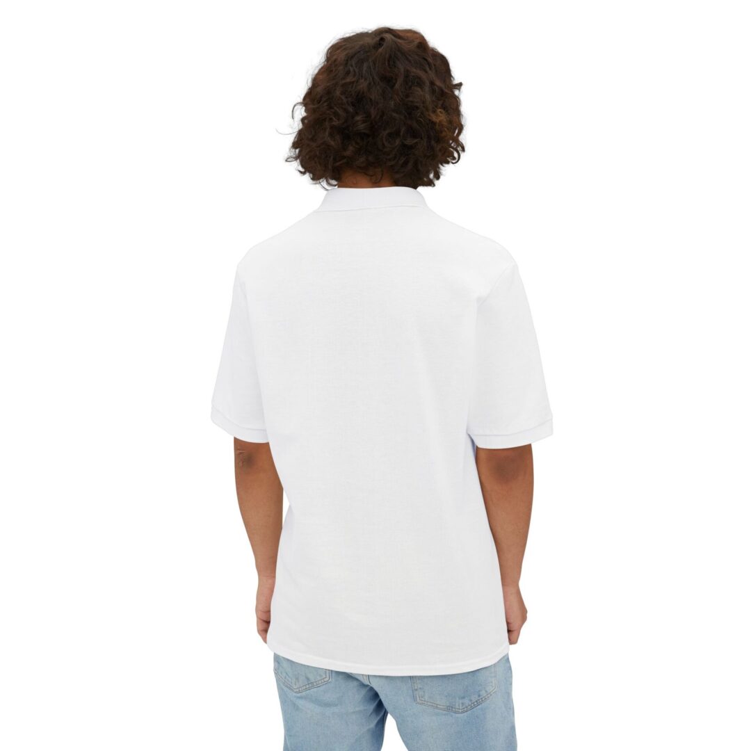 Person in white shirt, blue jeans, back view.