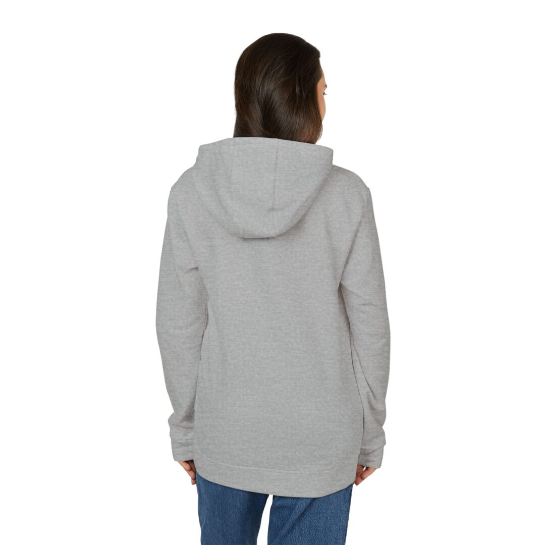 Woman in gray hoodie, facing away.