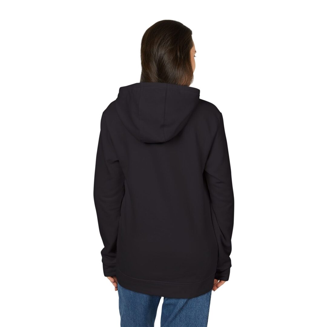 Person in black hoodie facing away.