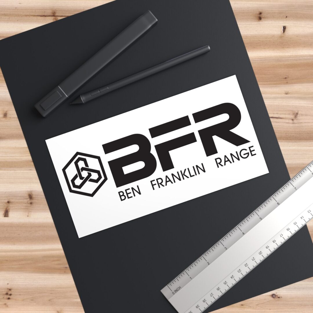 Black notebook with pen, ruler, BFR sticker.