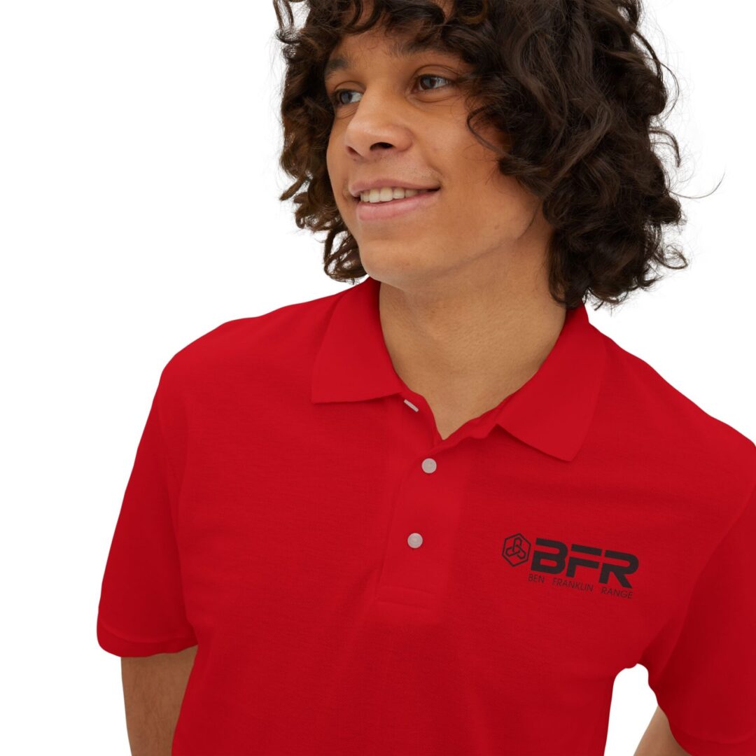 Smiling person in red BFR polo shirt.