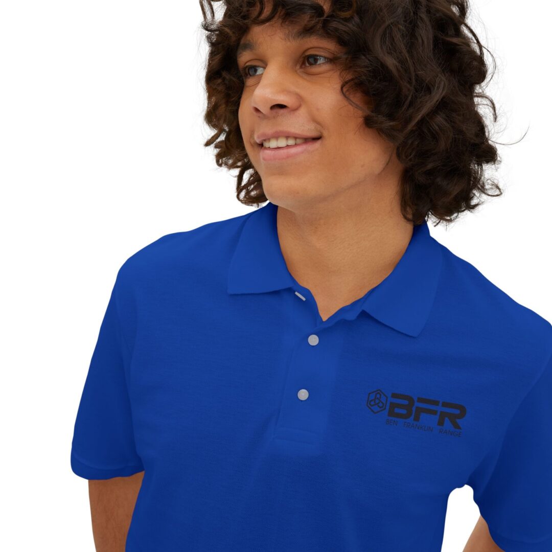 Smiling person in blue BFR-branded polo.