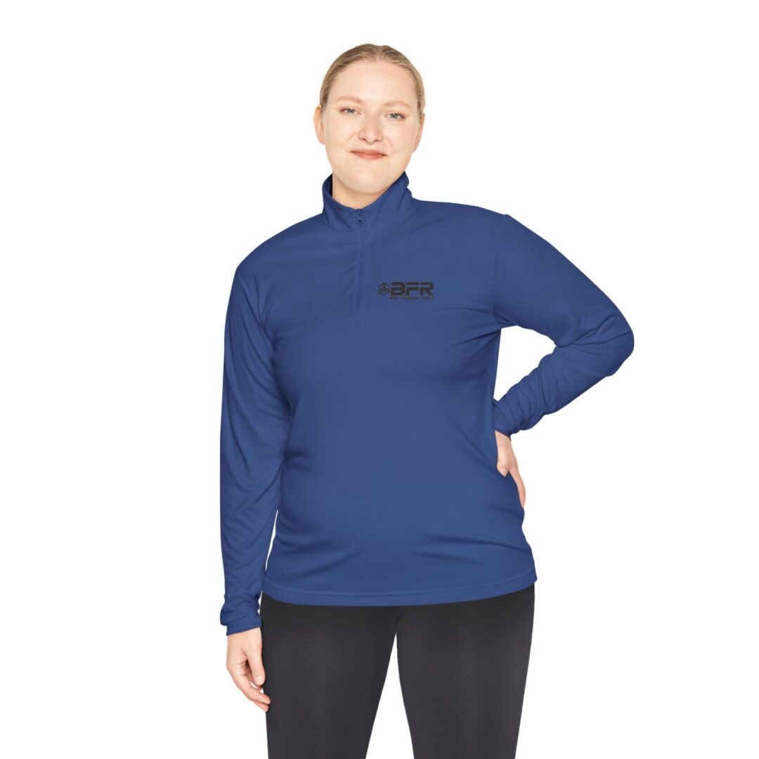 Woman in blue long-sleeve zip-up shirt.