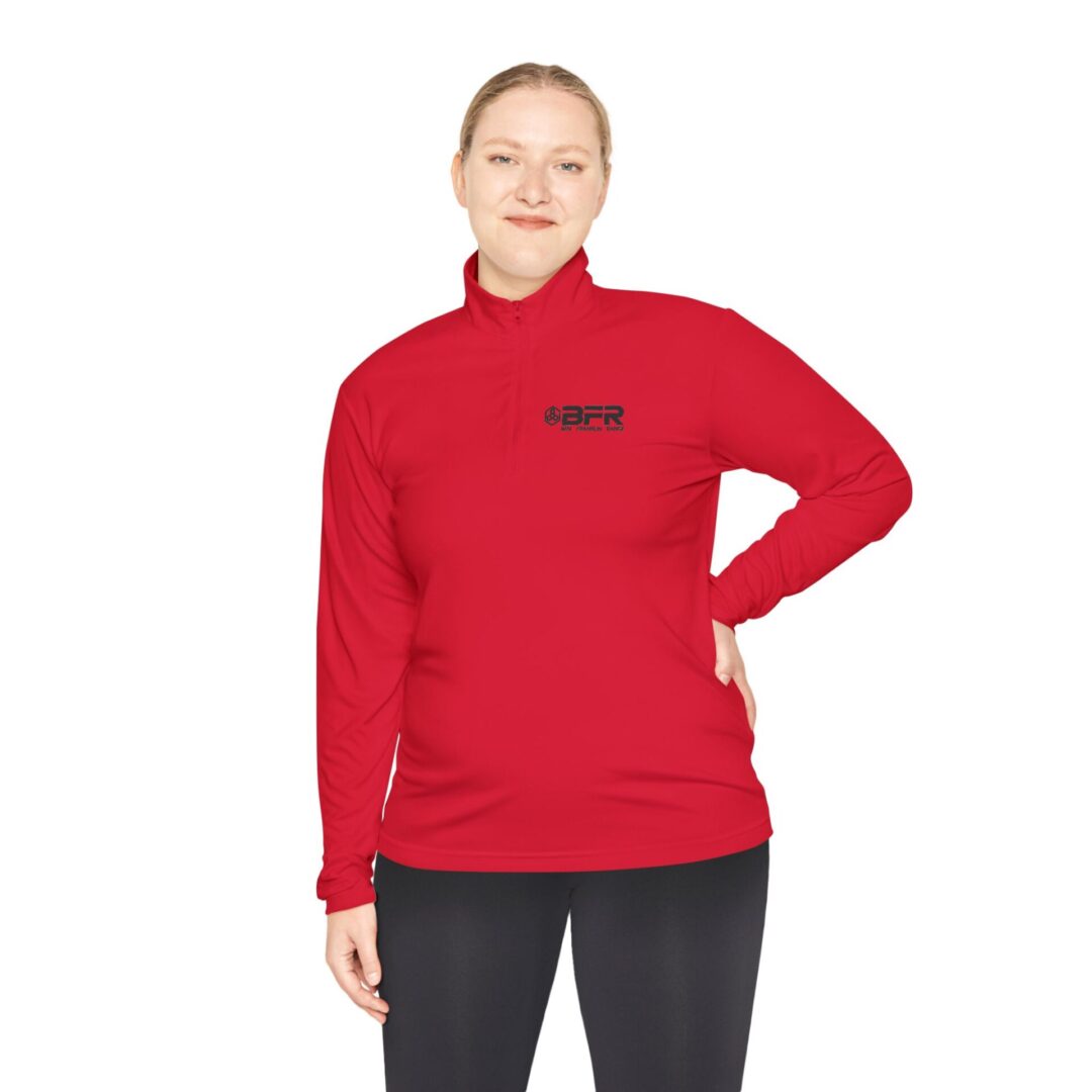 Woman in red quarter-zip athletic shirt.