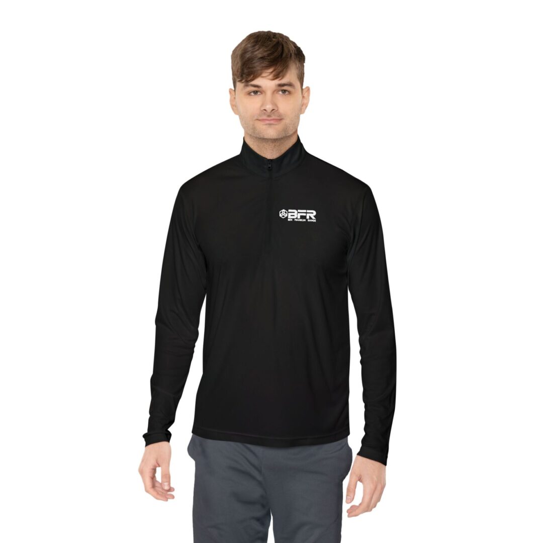 Here's an alt tag for the image: Man in black long-sleeve shirt.