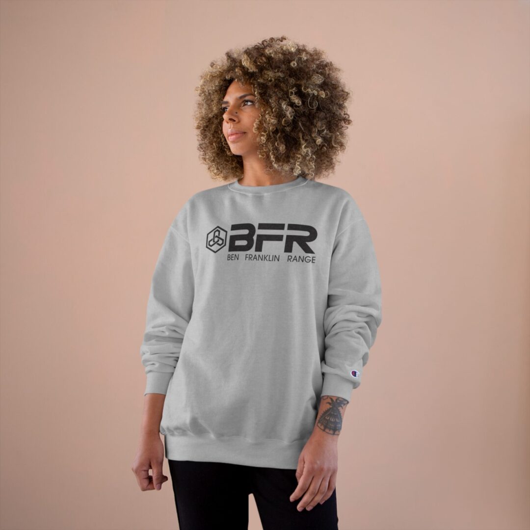 Person wearing gray BFR sweatshirt, neutral background. Person wearing gray BFR sweatshirt, neutral background.