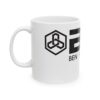 White mug with black geometric logo.