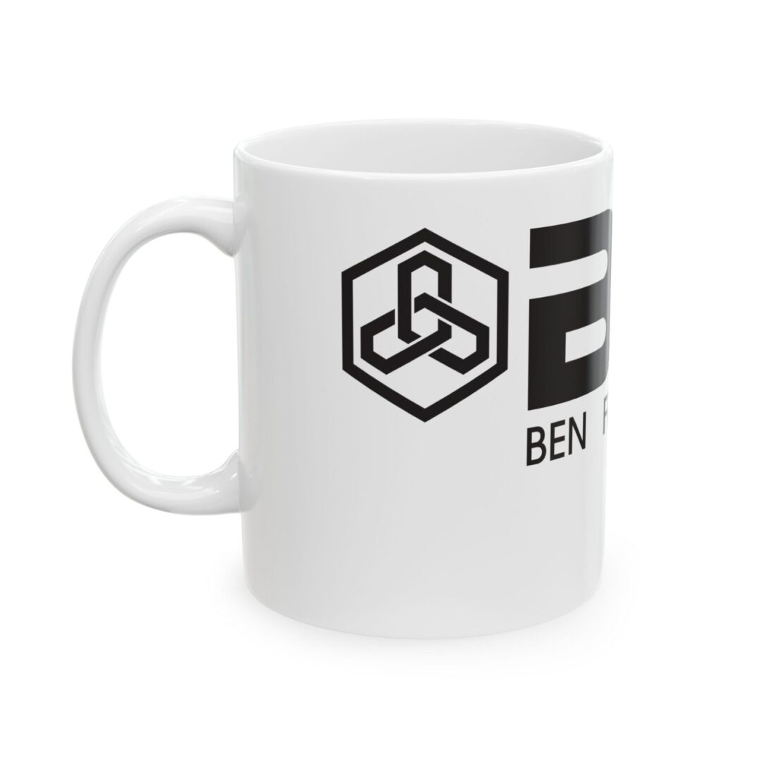 White mug with black geometric logo.