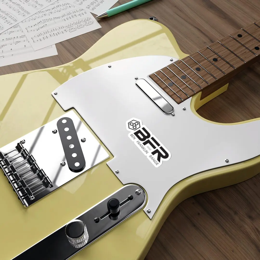 Yellow electric guitar on wooden surface.