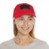Smiling person wearing red baseball cap.