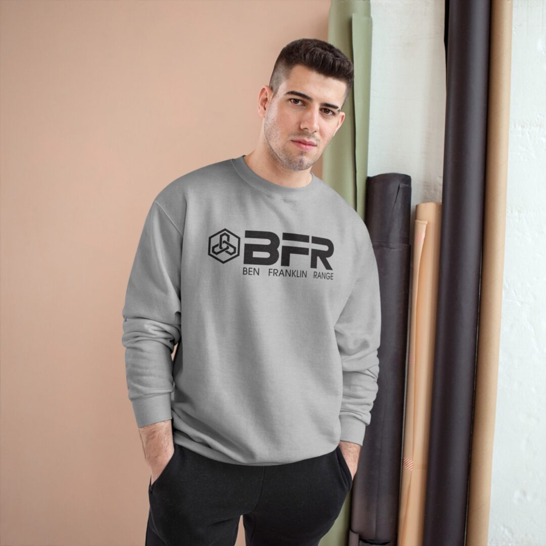 Man wearing gray BFR sweatshirt, beige background. Man wearing gray BFR sweatshirt, beige background.