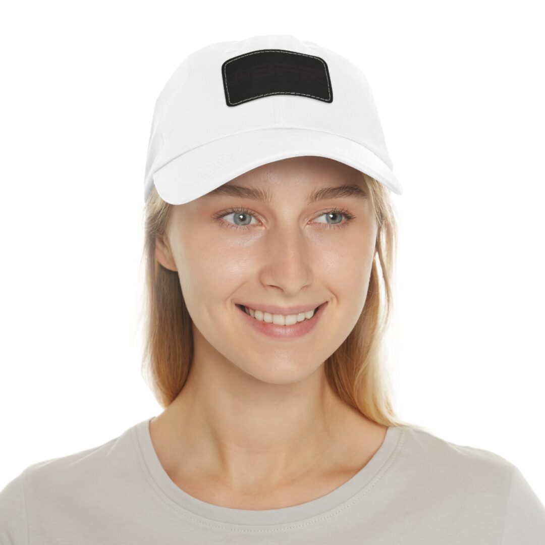 Smiling person wearing a white baseball cap.