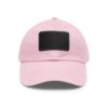 Pink baseball cap with black patch.