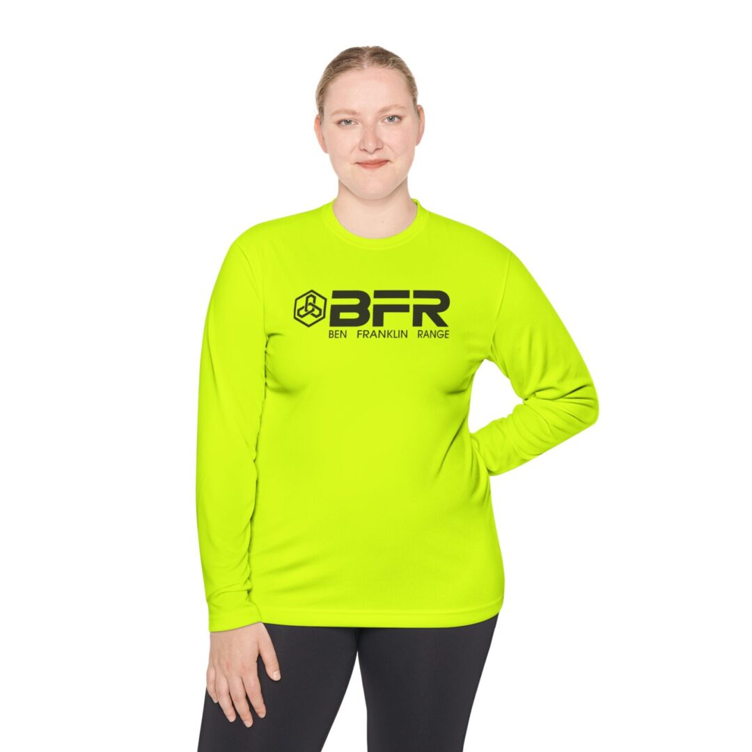 Person wearing bright green long-sleeve shirt.