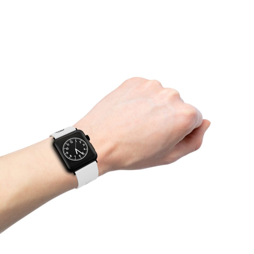 Wrist with black smartwatch, white band.