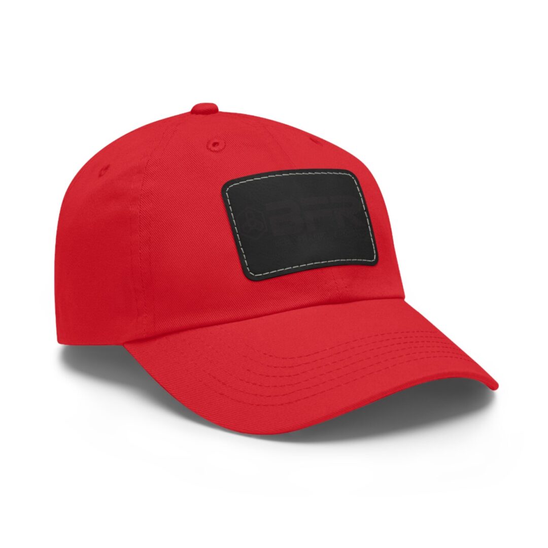 Red baseball cap with black front patch.