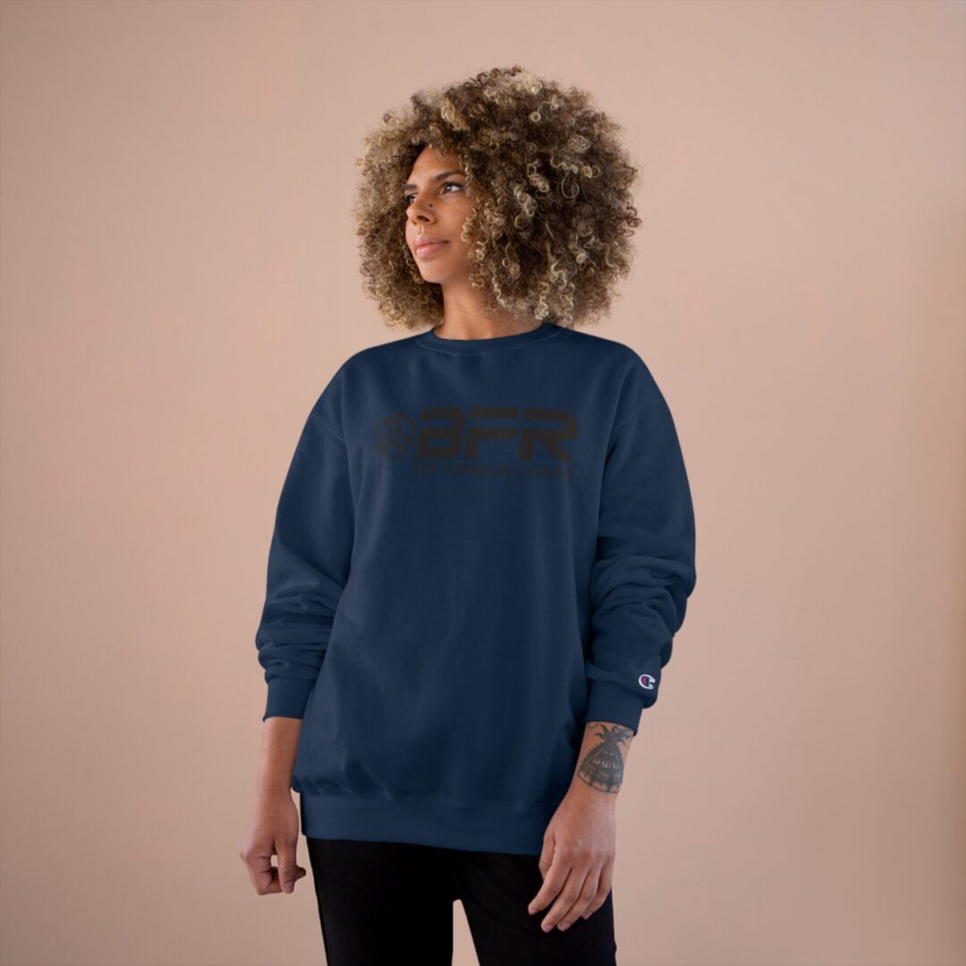 Person wearing a blue sweatshirt, neutral background. Person wearing a blue sweatshirt, neutral background.