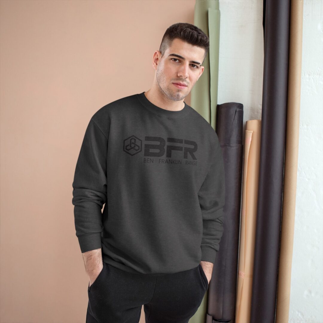 Man in black BFR sweatshirt, neutral background. Man in black BFR sweatshirt, neutral background.