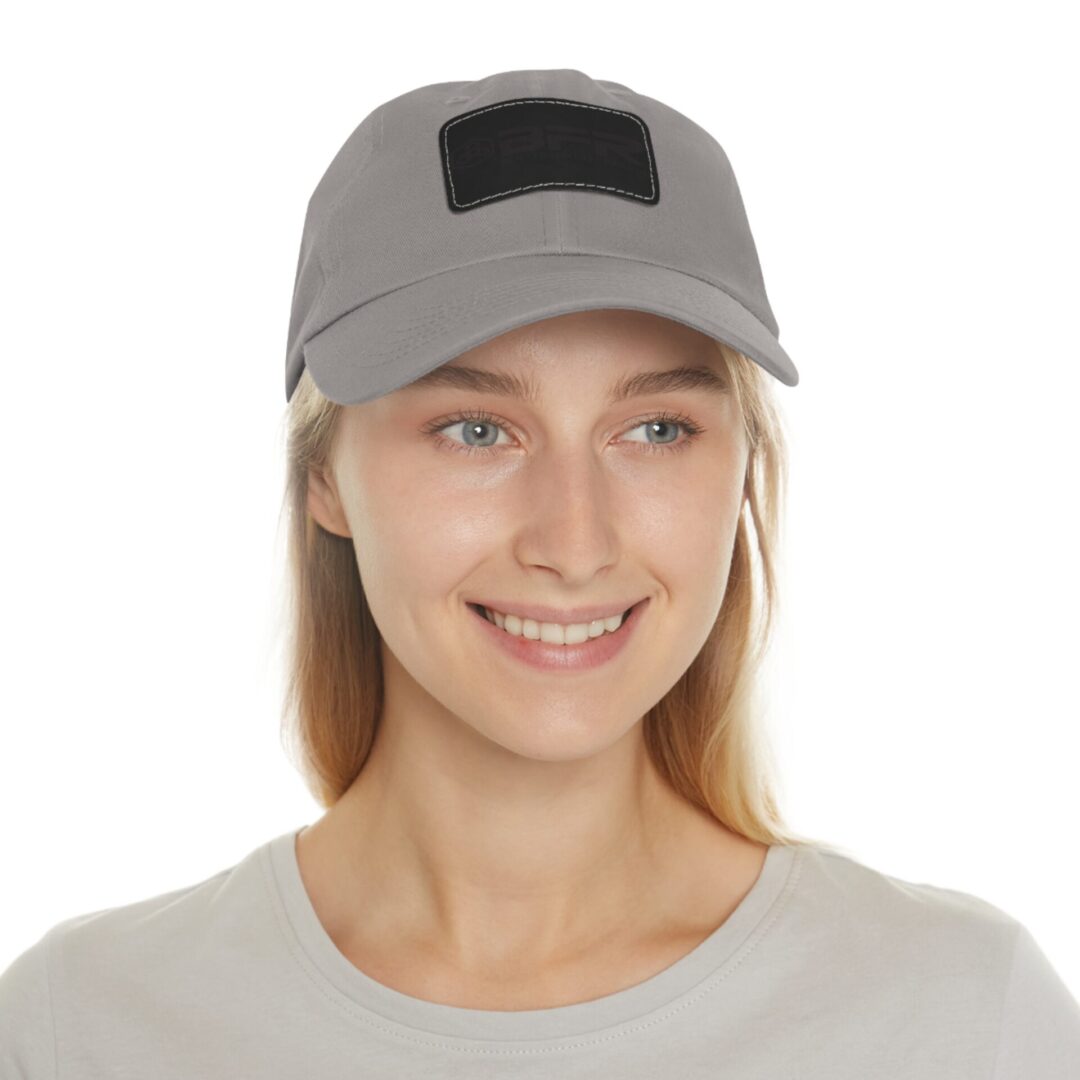 Person wearing a gray cap, smiling.